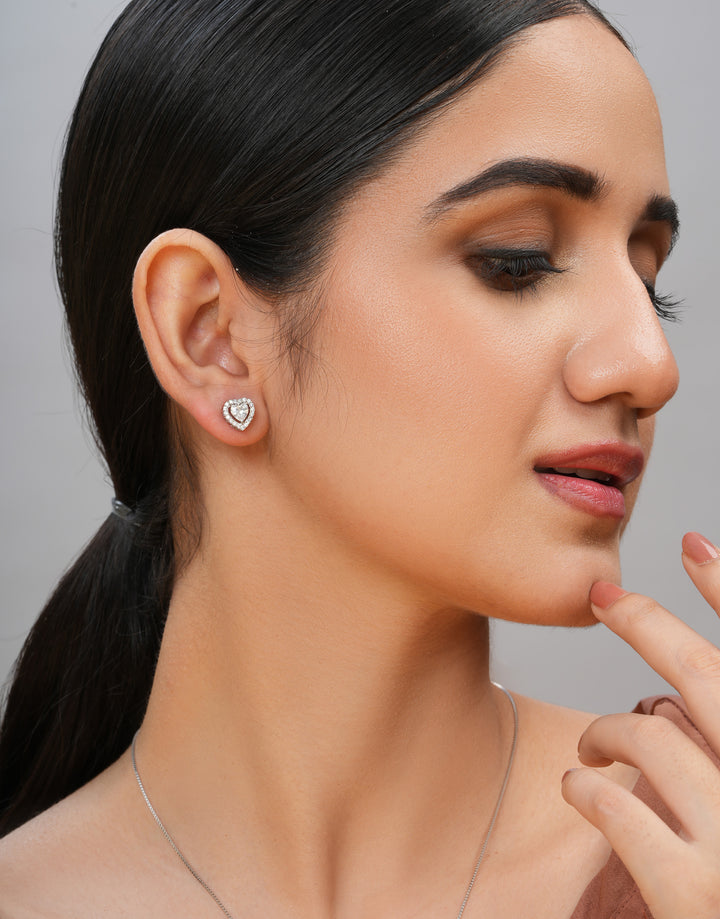 heart-shaped sterling silver charm and stud earrings set with multiple cz stones